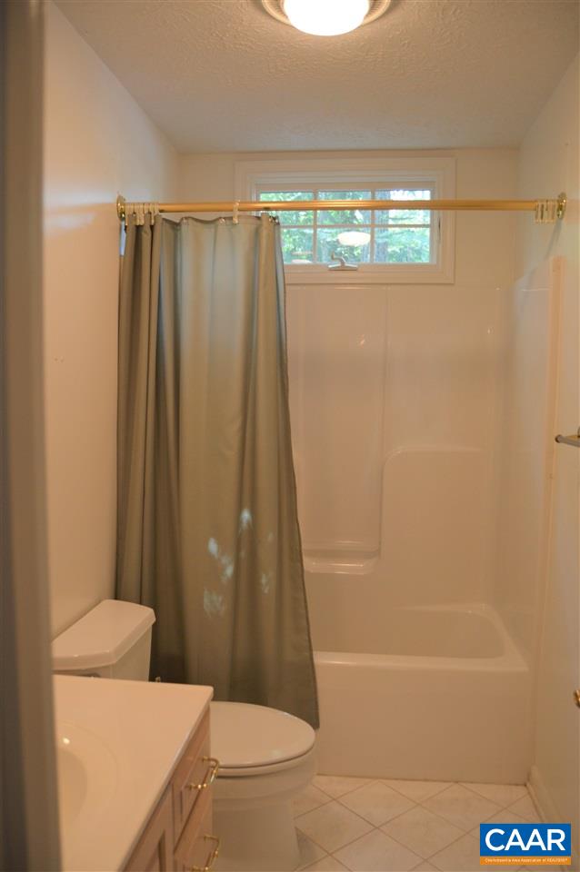 17 Oak Grove Road Palmyra, VA 22963 - Photo 16 of 24 a bathroom with a shower and a toilet