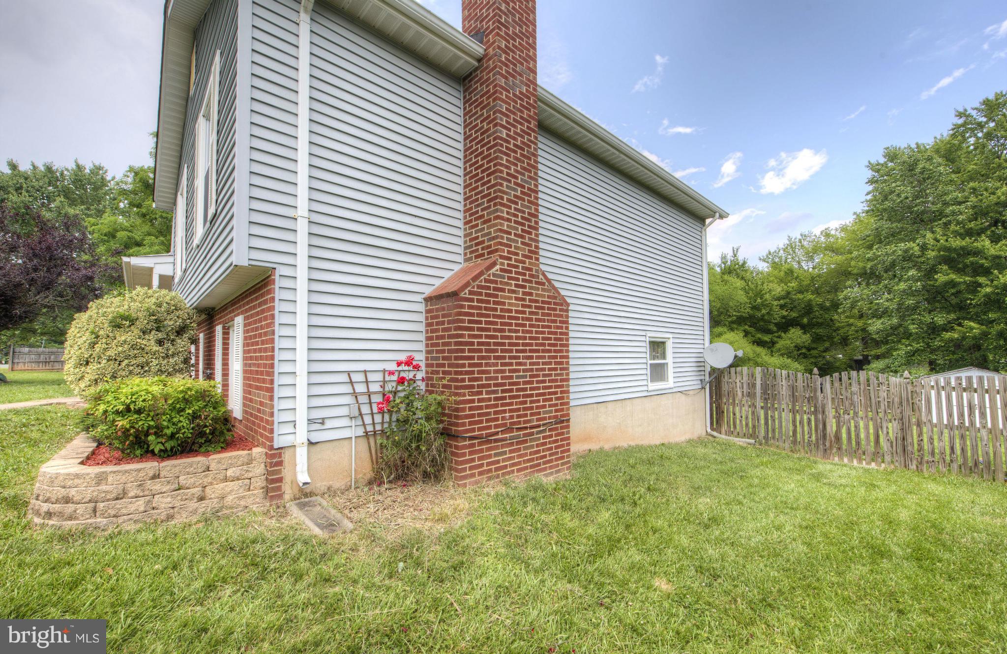 55 Buck Road Stafford, VA 22556 - Photo 3 of 19 a backyard of a house with plants and tree
