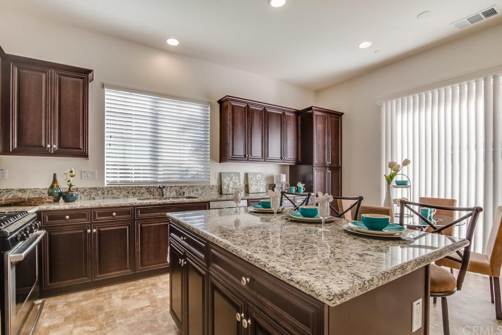 Gorgeous details llike slab granite counters accent the kitchen