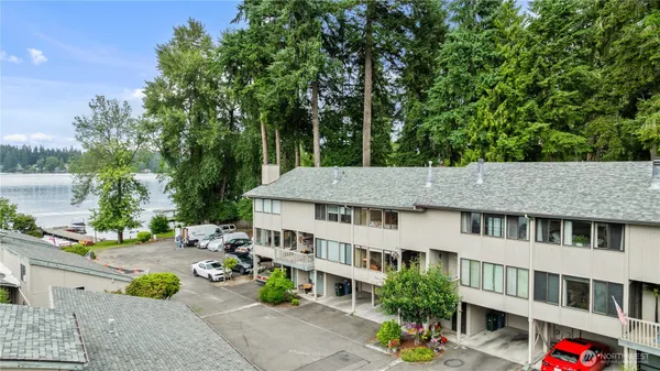 a aerial view of a house with garden and trees