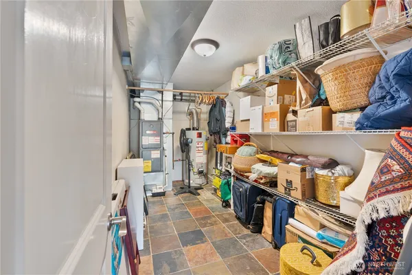 a utility room with lots of appliances and cabinets