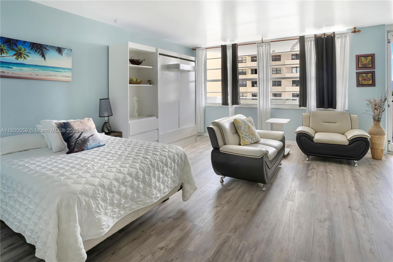 100 Lincoln Road, Unit 607 Miami Beach, FL 33139 - Photo 11 of 30 a bedroom with a bed and a couch