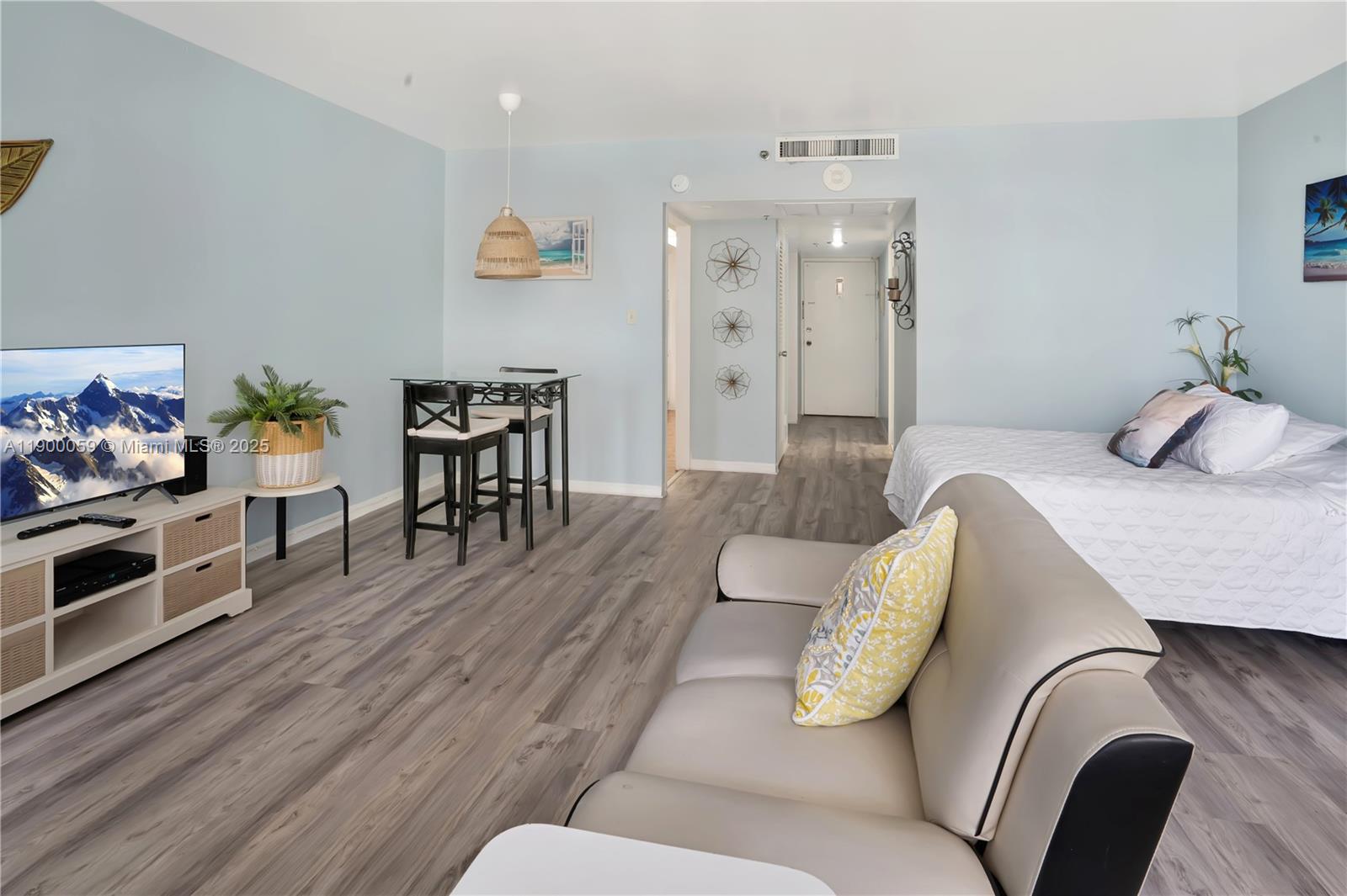 100 Lincoln Road, Unit 607 Miami Beach, FL 33139 - Photo 13 of 30 a living room with furniture and wooden floor