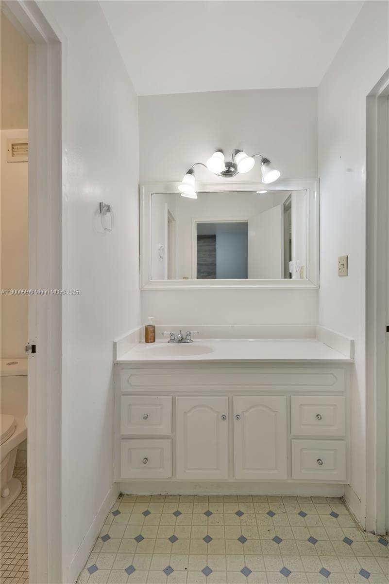 100 Lincoln Road, Unit 607 Miami Beach, FL 33139 - Photo 14 of 30 a bathroom with a sink and a mirror
