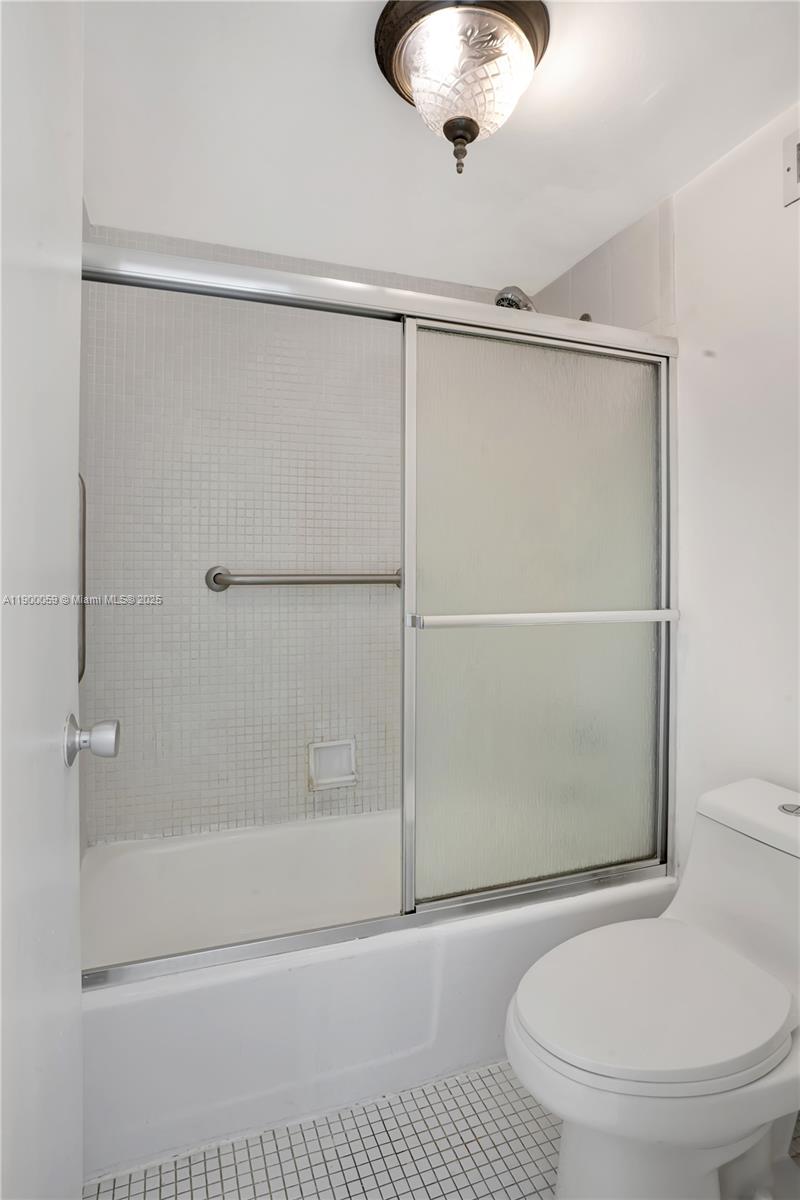 100 Lincoln Road, Unit 607 Miami Beach, FL 33139 - Photo 15 of 30 a bathroom with a shower and a toilet