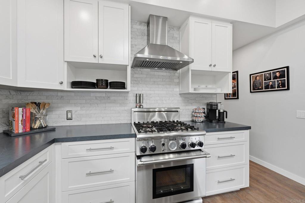 637 Sparta Drive, Unit A & B Encinitas, CA 92024 - Photo 11 of 58 a kitchen with stainless steel appliances granite countertop white cabinets and a stove