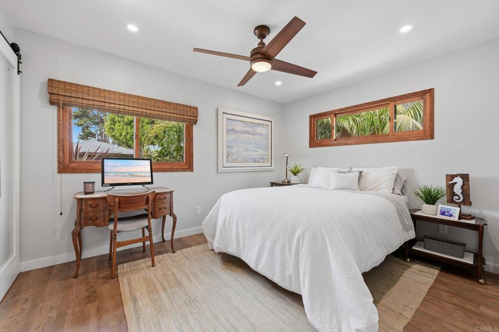 637 Sparta Drive, Unit A & B Encinitas, CA 92024 - Photo 22 of 58 a bedroom with a bed and a desk
