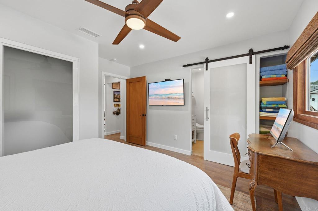 637 Sparta Drive, Unit A & B Encinitas, CA 92024 - Photo 23 of 58 a bedroom with a bed and a desk