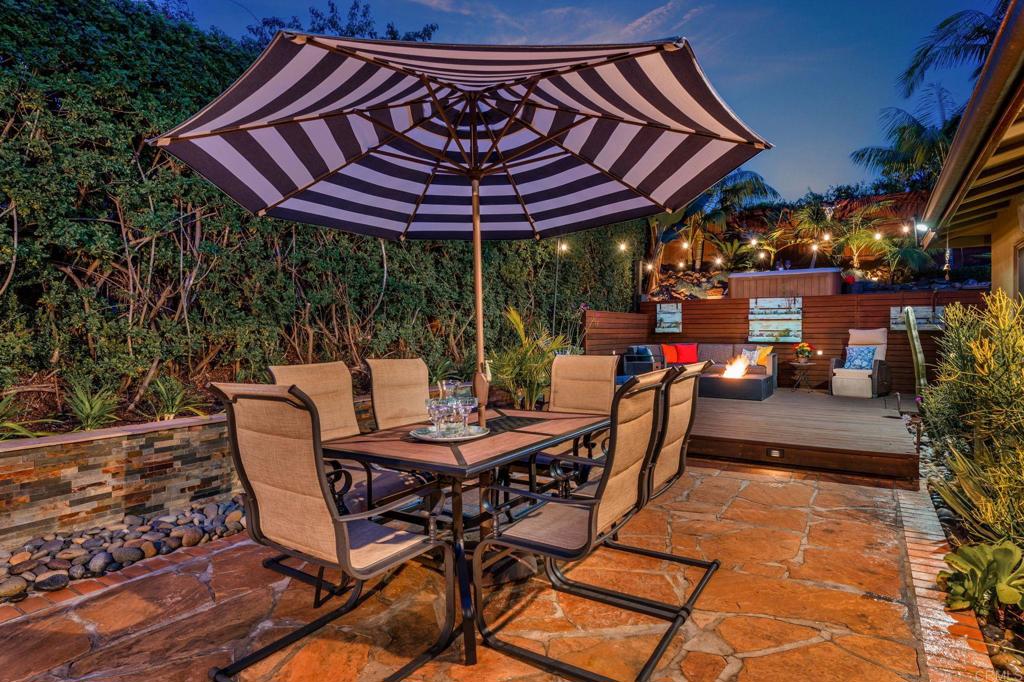 637 Sparta Drive, Unit A & B Encinitas, CA 92024 - Photo 29 of 58 a patio with a patio table and chairs