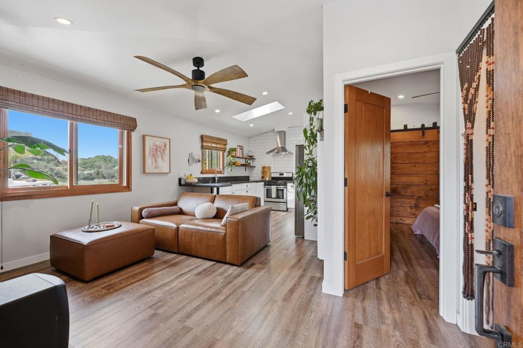 637 Sparta Drive, Unit A & B Encinitas, CA 92024 - Photo 38 of 58 a living room with furniture and a large window