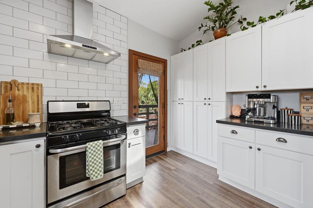 637 Sparta Drive, Unit A & B Encinitas, CA 92024 - Photo 41 of 58 a kitchen with cabinets appliances and wooden floor