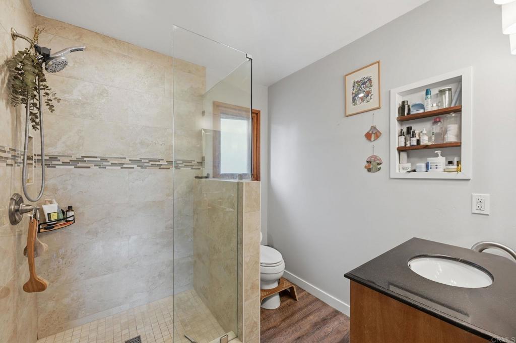 637 Sparta Drive, Unit A & B Encinitas, CA 92024 - Photo 47 of 58 a bathroom with a granite countertop sink toilet and shower