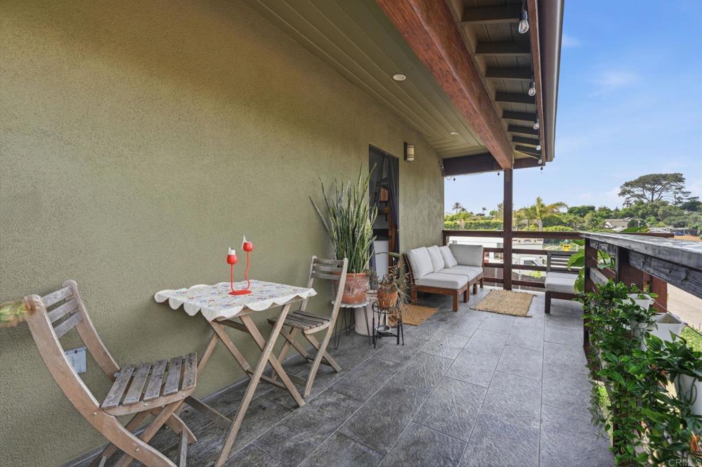 637 Sparta Drive, Unit A & B Encinitas, CA 92024 - Photo 49 of 58 a view of a dining room with furniture and chandelier