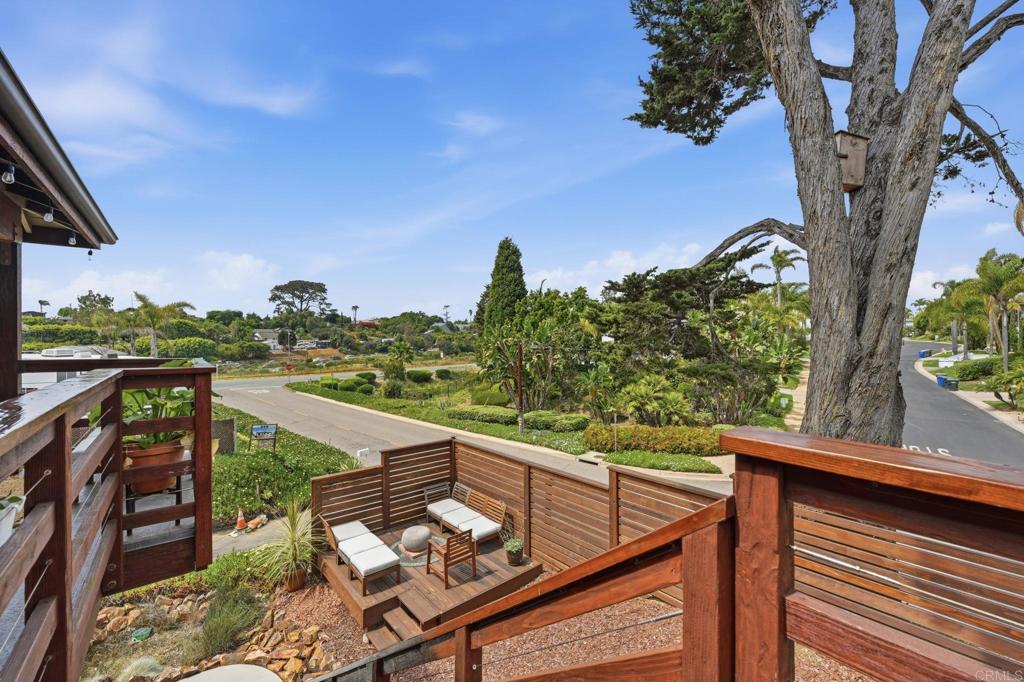 637 Sparta Drive, Unit A & B Encinitas, CA 92024 - Photo 50 of 58 a view of a balcony with wooden floor and outdoor seating