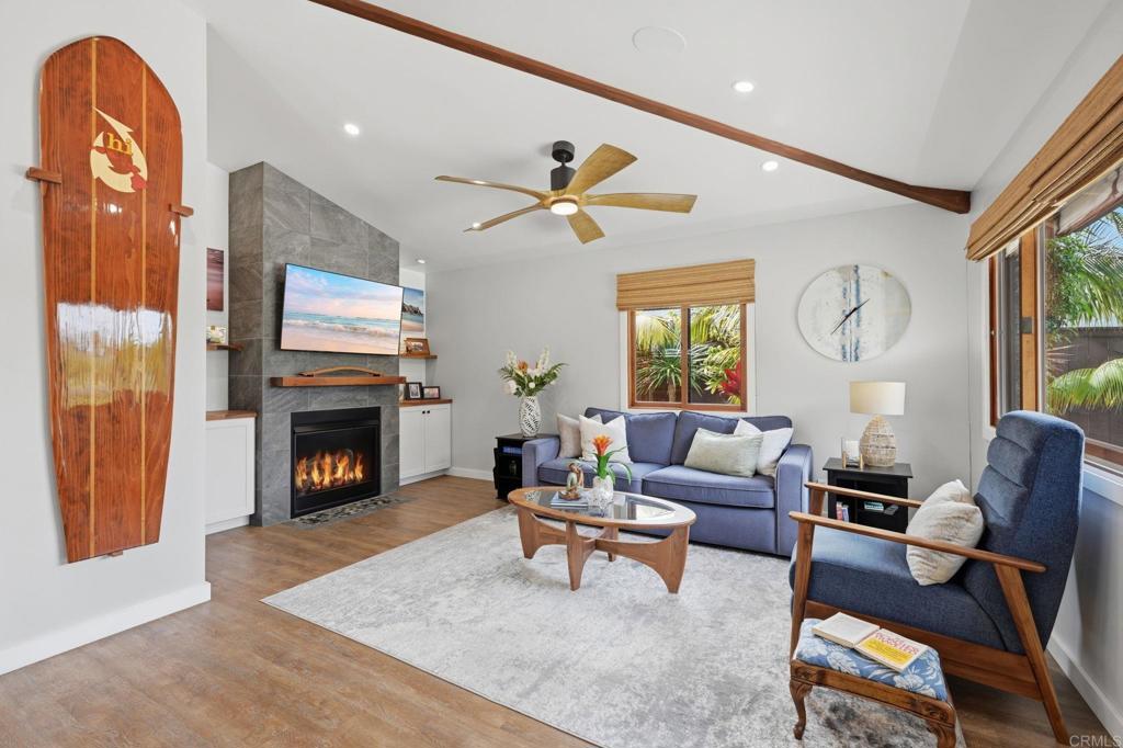 637 Sparta Drive, Unit A & B Encinitas, CA 92024 - Photo 5 of 58 a living room with furniture a fireplace and a flat screen tv