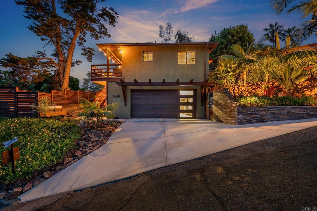 637 Sparta Drive, Unit A & B Encinitas, CA 92024 - Photo 52 of 58 a front view of a house with a yard and garage