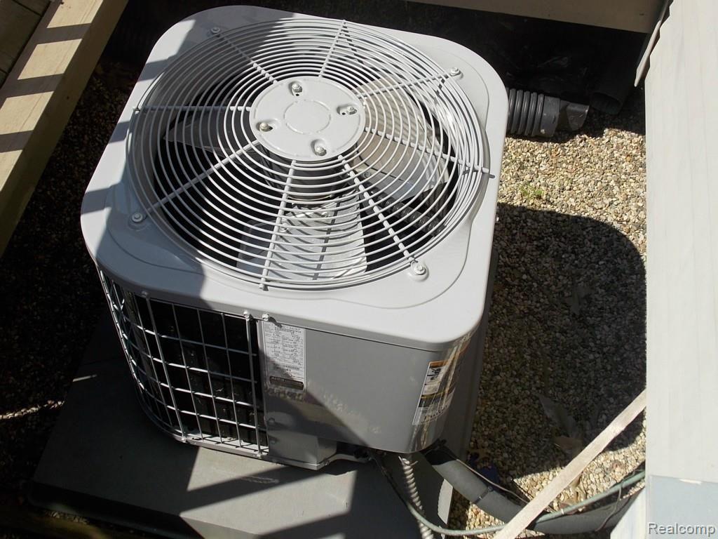 556 Harrow Court, Unit 47 Rochester, MI 48307 - Photo 17 of 28 New Air Conditioner
