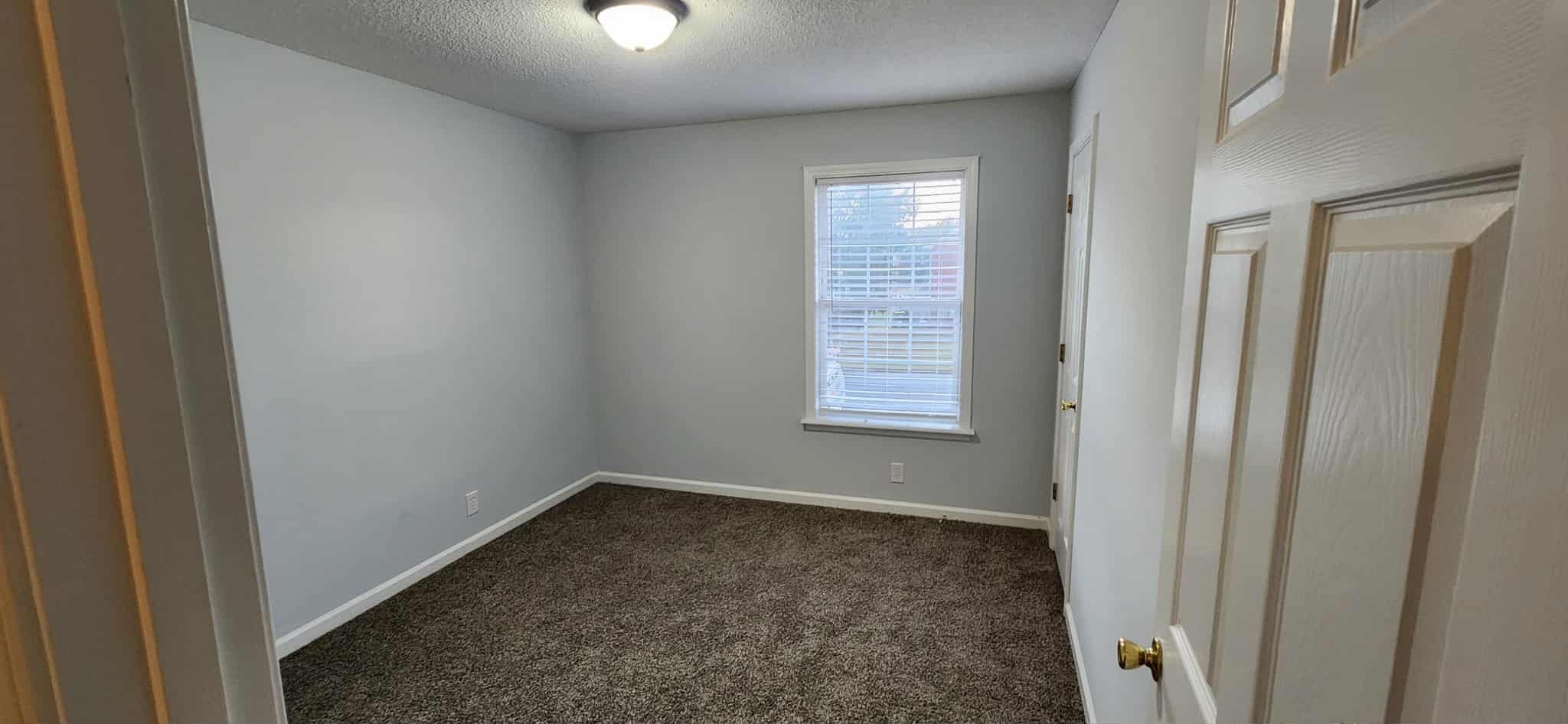 289 Raleigh Drive, Unit B Clarksville, TN 37043 - Photo 20 of 22 an empty room with windows and closet