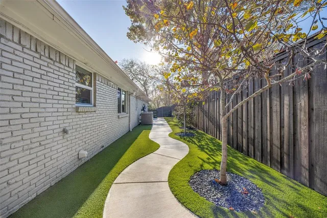 a view of a backyard with swimming pool