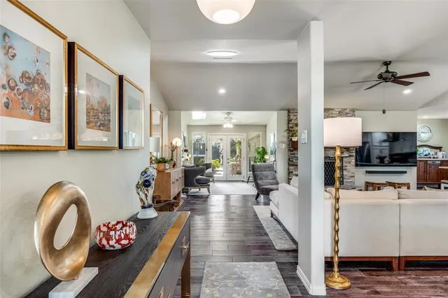 a very nice looking living room with dining room and wooden floor