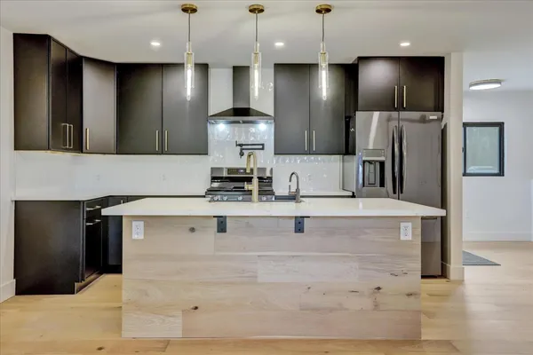 a view of a livingroom with a ceiling fan and window