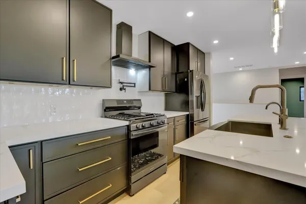 a view of a livingroom with a red ceiling fan and window