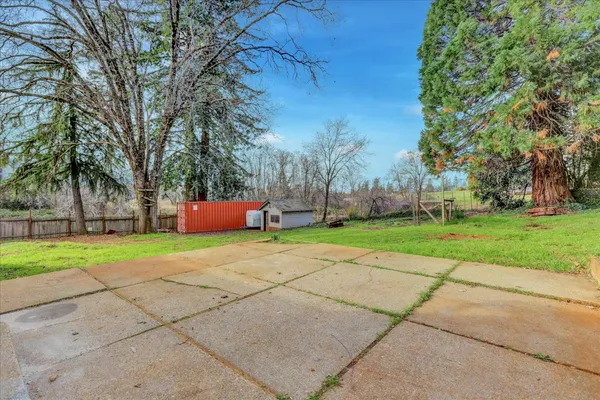 a backyard of a house with lots of green space