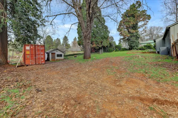 a backyard of a house with lots of green space