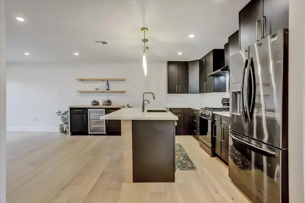 a kitchen with a stove and a microwave