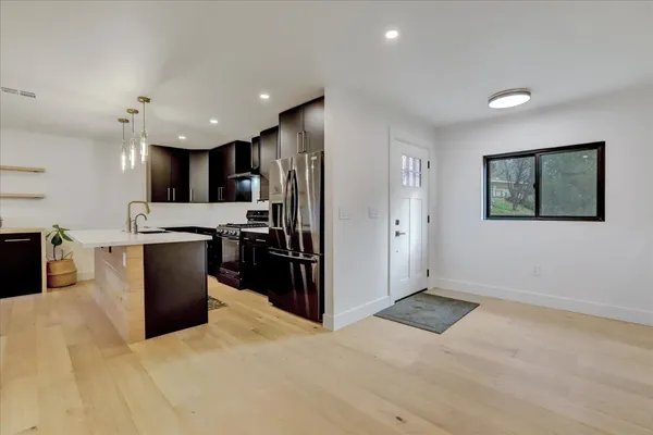 a kitchen with a sink and a window