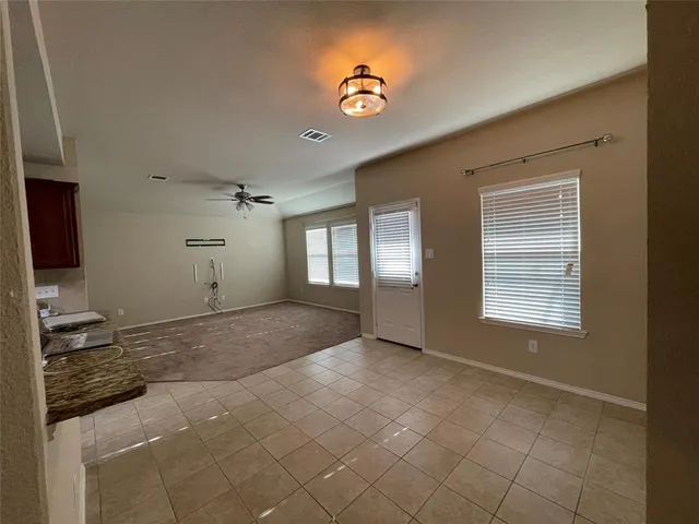 a view of an empty room and window