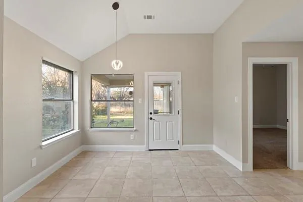 a view of an empty room with a window