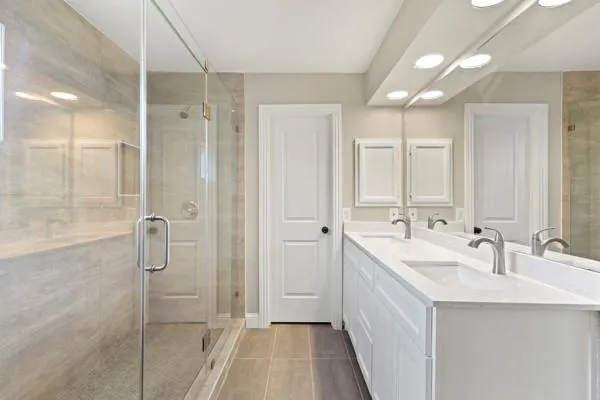 a bathroom with a double vanity sink mirror and double