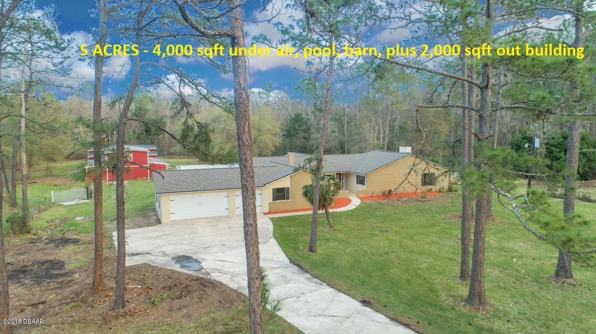 a view of a park with iron fence