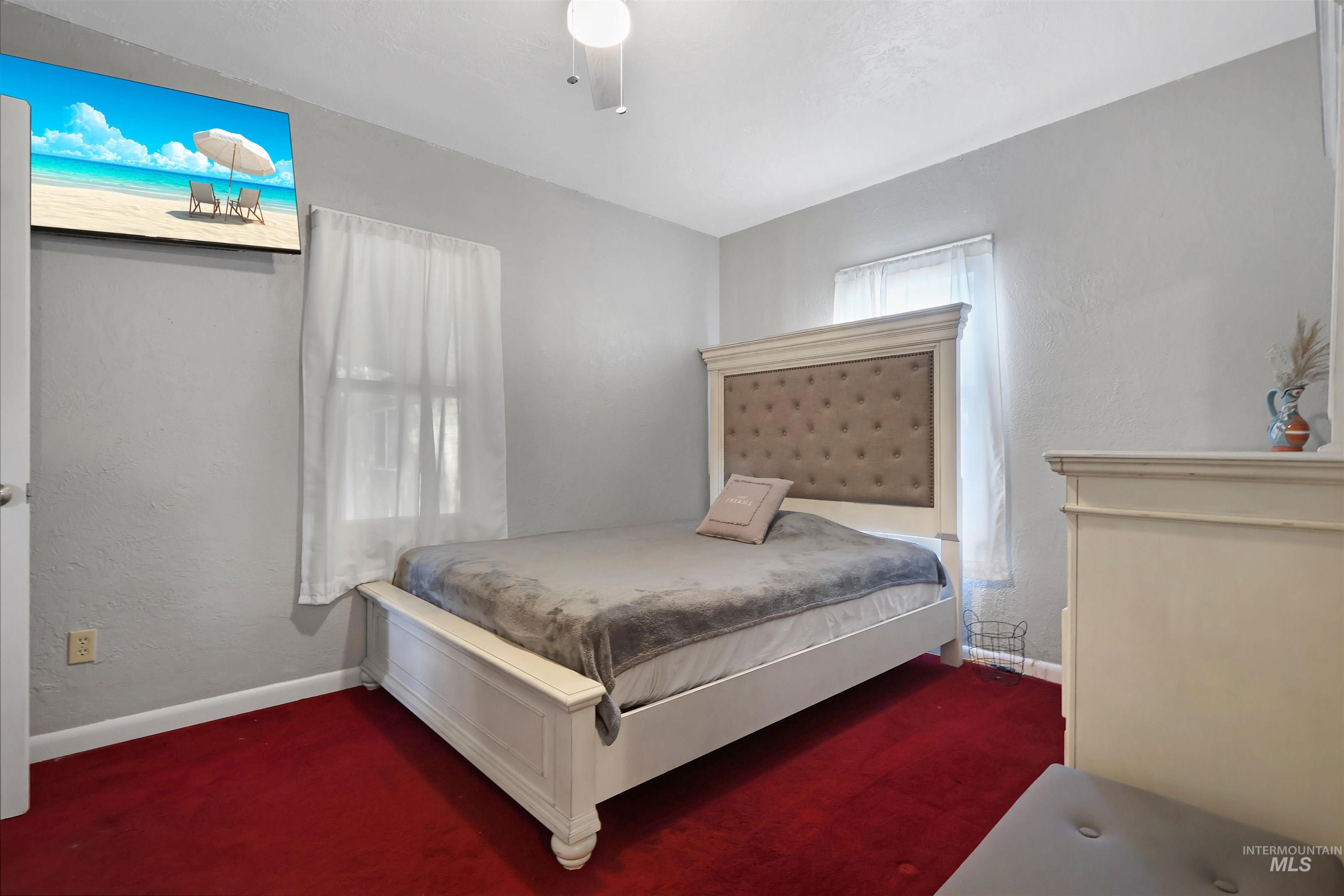 1009 9th Street Rupert, ID 83350 - Photo 13 of 28 Red carpeting and light gray wall finishes