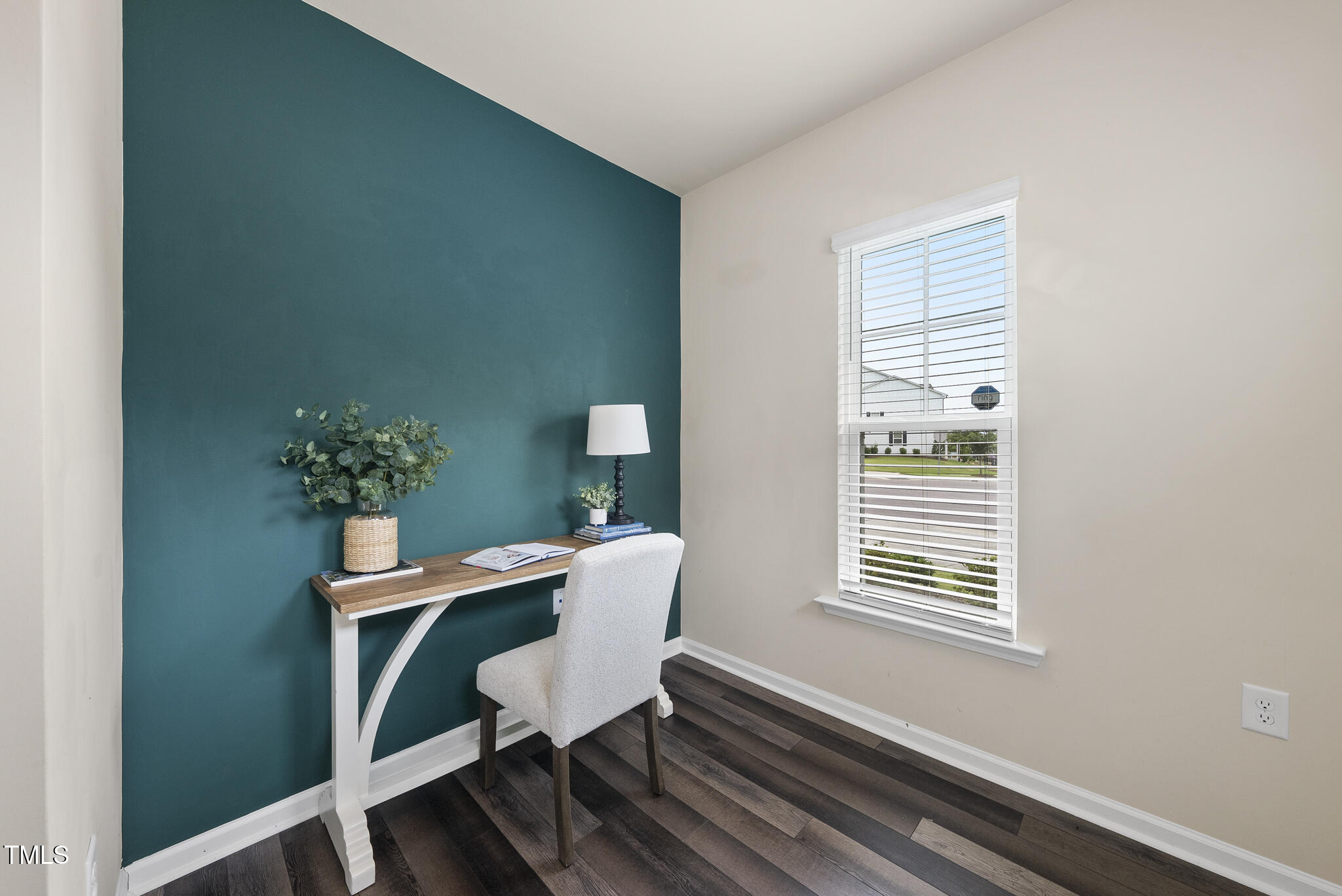 5340 Faulkner Street Durham, NC 27560 - Photo 13 of 31 a view of a workspace with furniture and a window