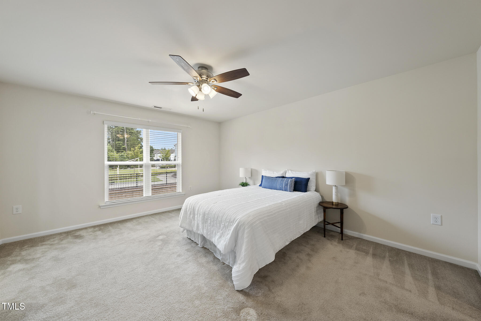 5340 Faulkner Street Durham, NC 27560 - Photo 16 of 31 a bedroom with a bed and a window