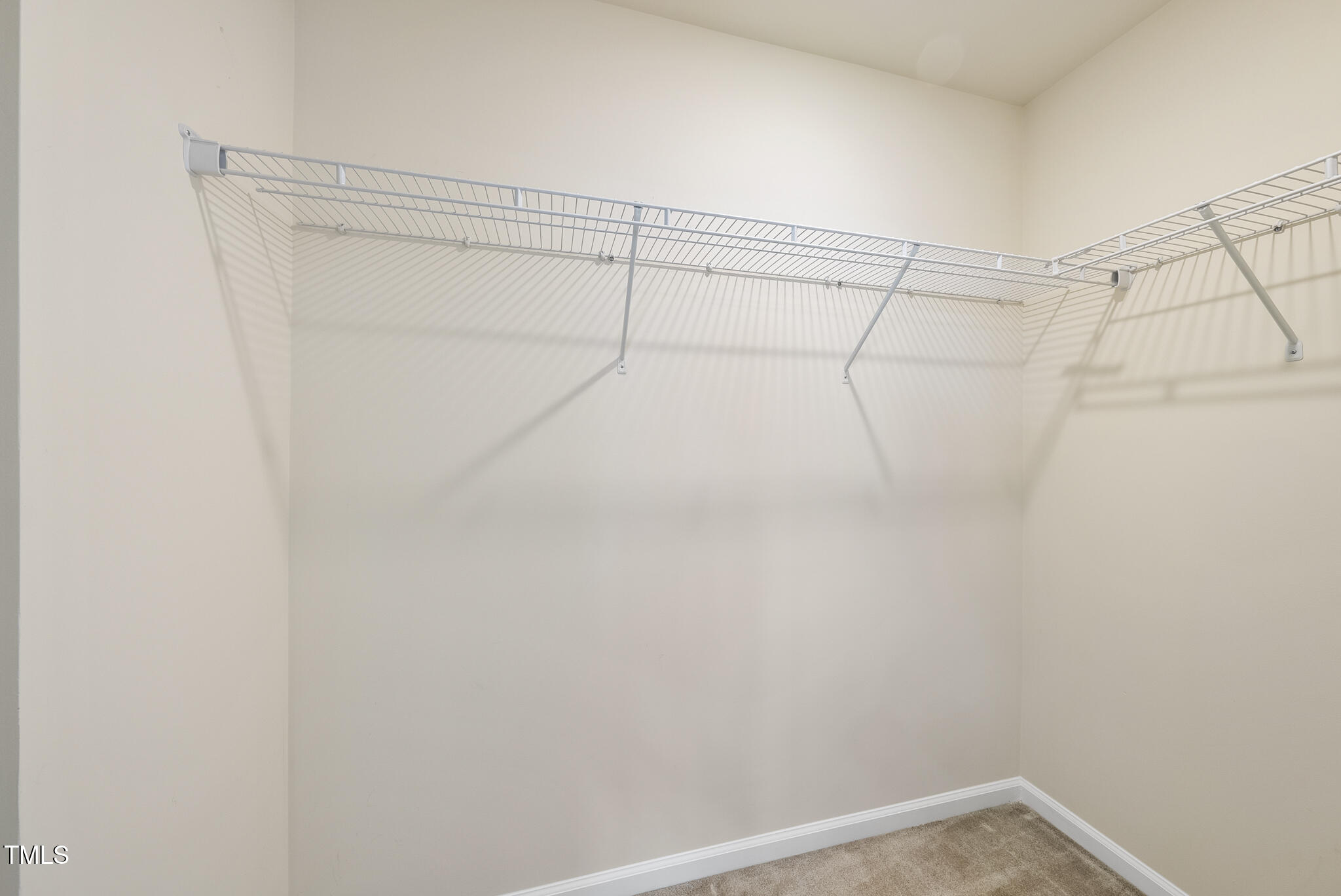 5340 Faulkner Street Durham, NC 27560 - Photo 21 of 31 a view of a room with racks on the wall