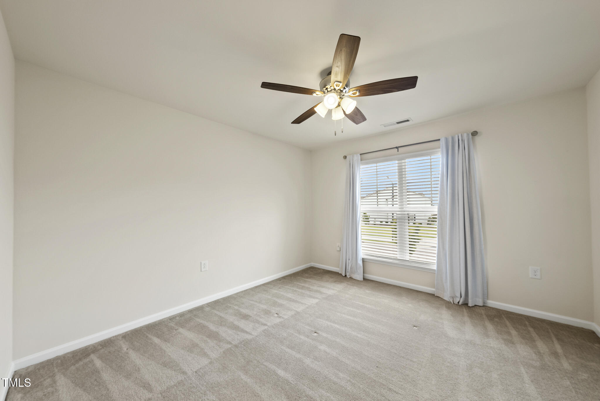 5340 Faulkner Street Durham, NC 27560 - Photo 24 of 31 an empty room with fan