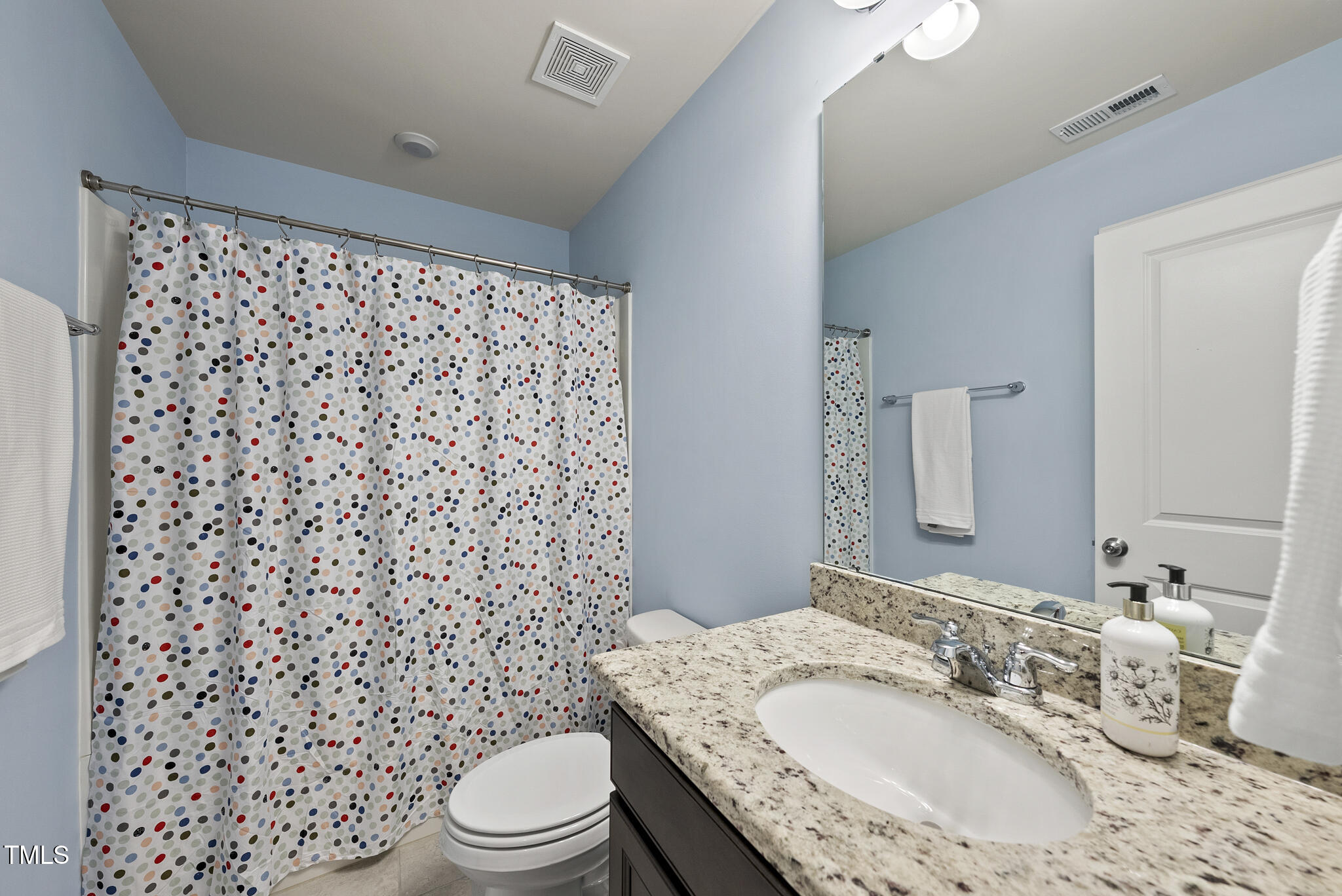 5340 Faulkner Street Durham, NC 27560 - Photo 26 of 31 a bathroom with a granite countertop sink toilet and shower