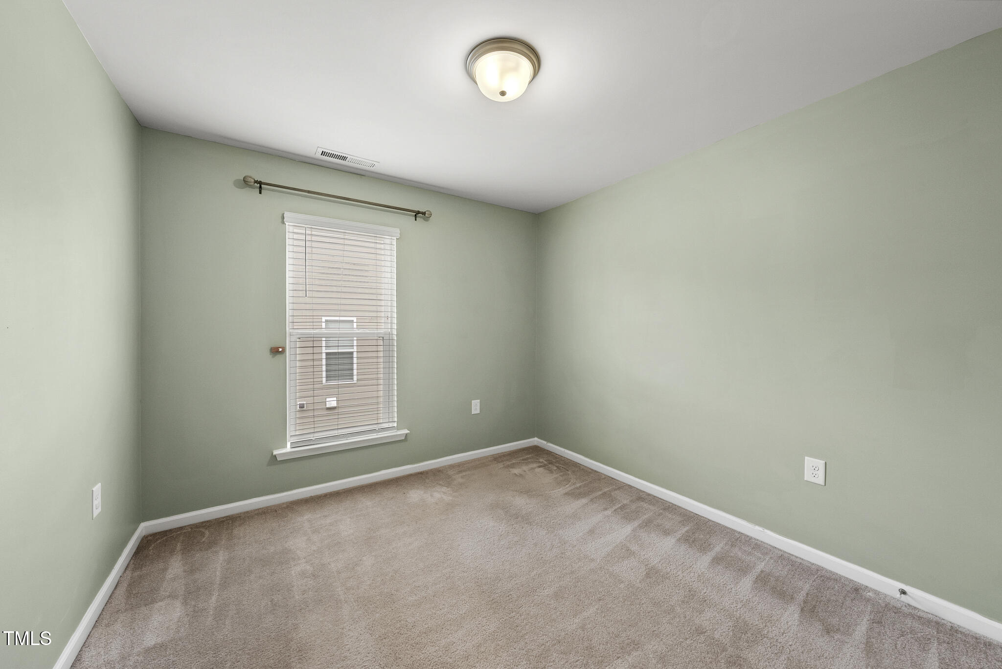 5340 Faulkner Street Durham, NC 27560 - Photo 27 of 31 an empty room with a window