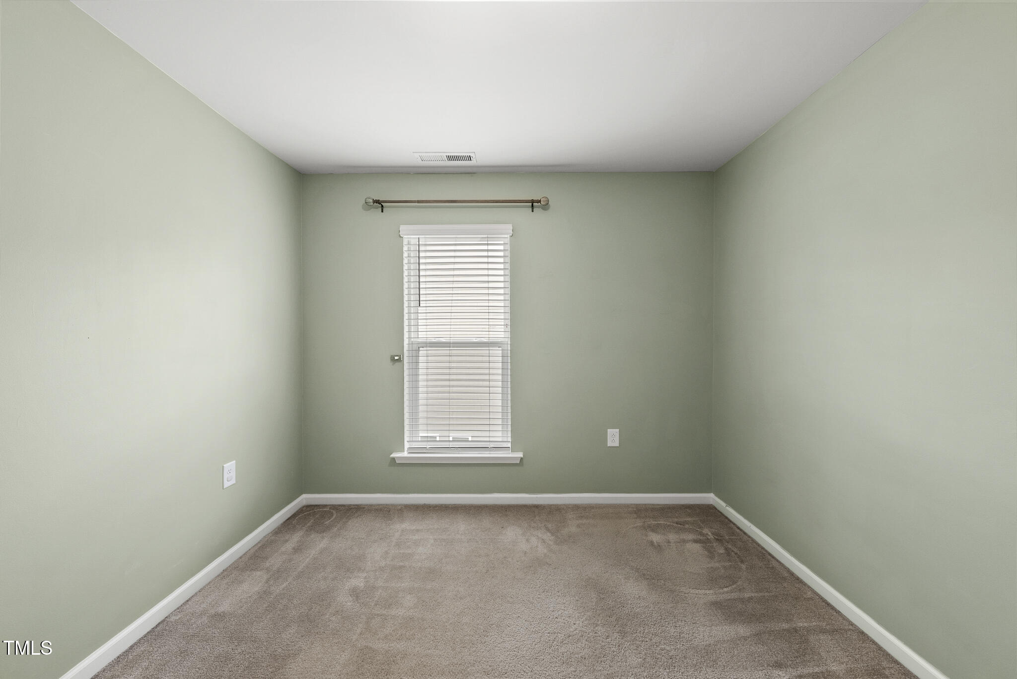 5340 Faulkner Street Durham, NC 27560 - Photo 28 of 31 an empty room with a window