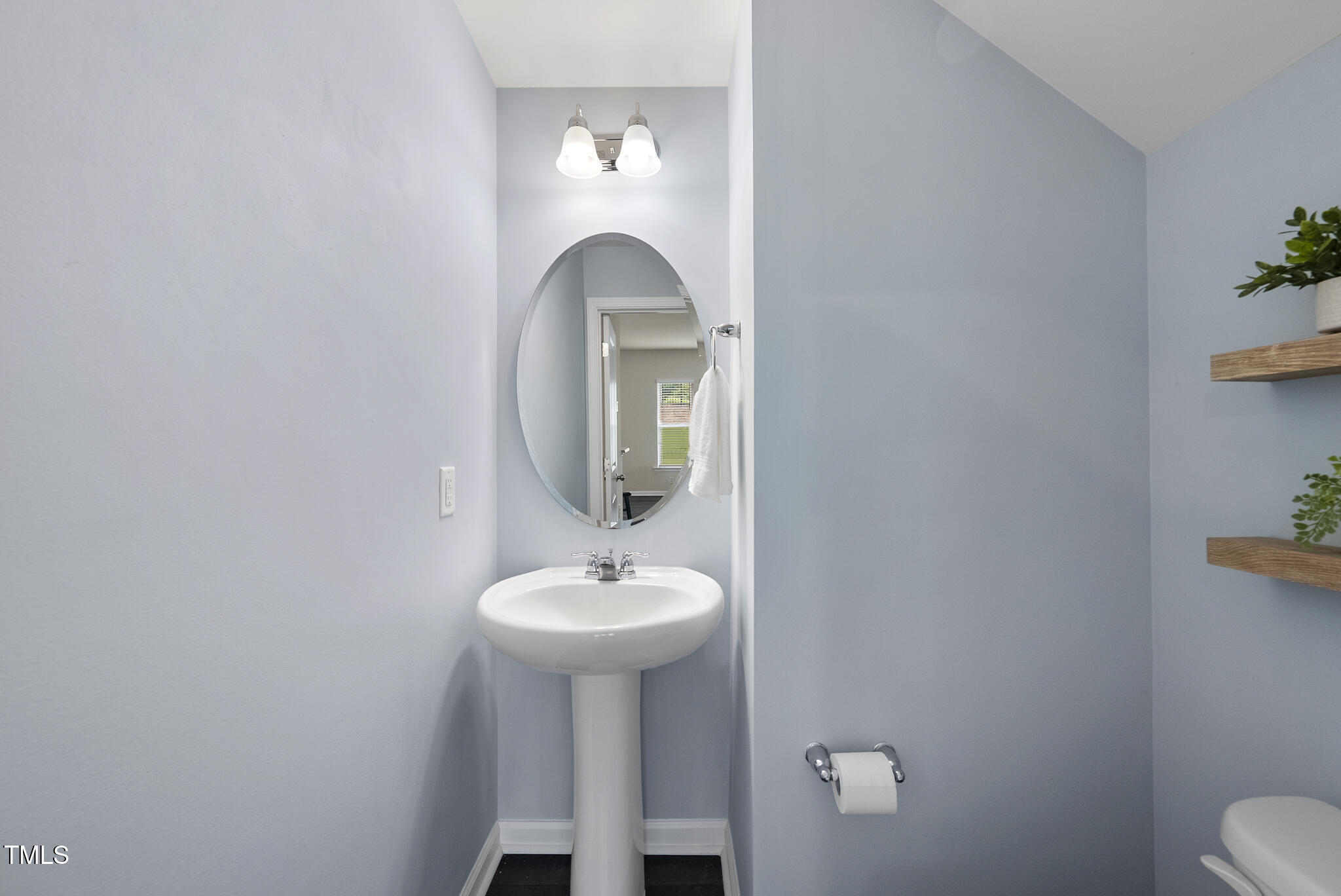 5340 Faulkner Street Durham, NC 27560 - Photo 30 of 31 a bathroom with a sink toilet and mirror