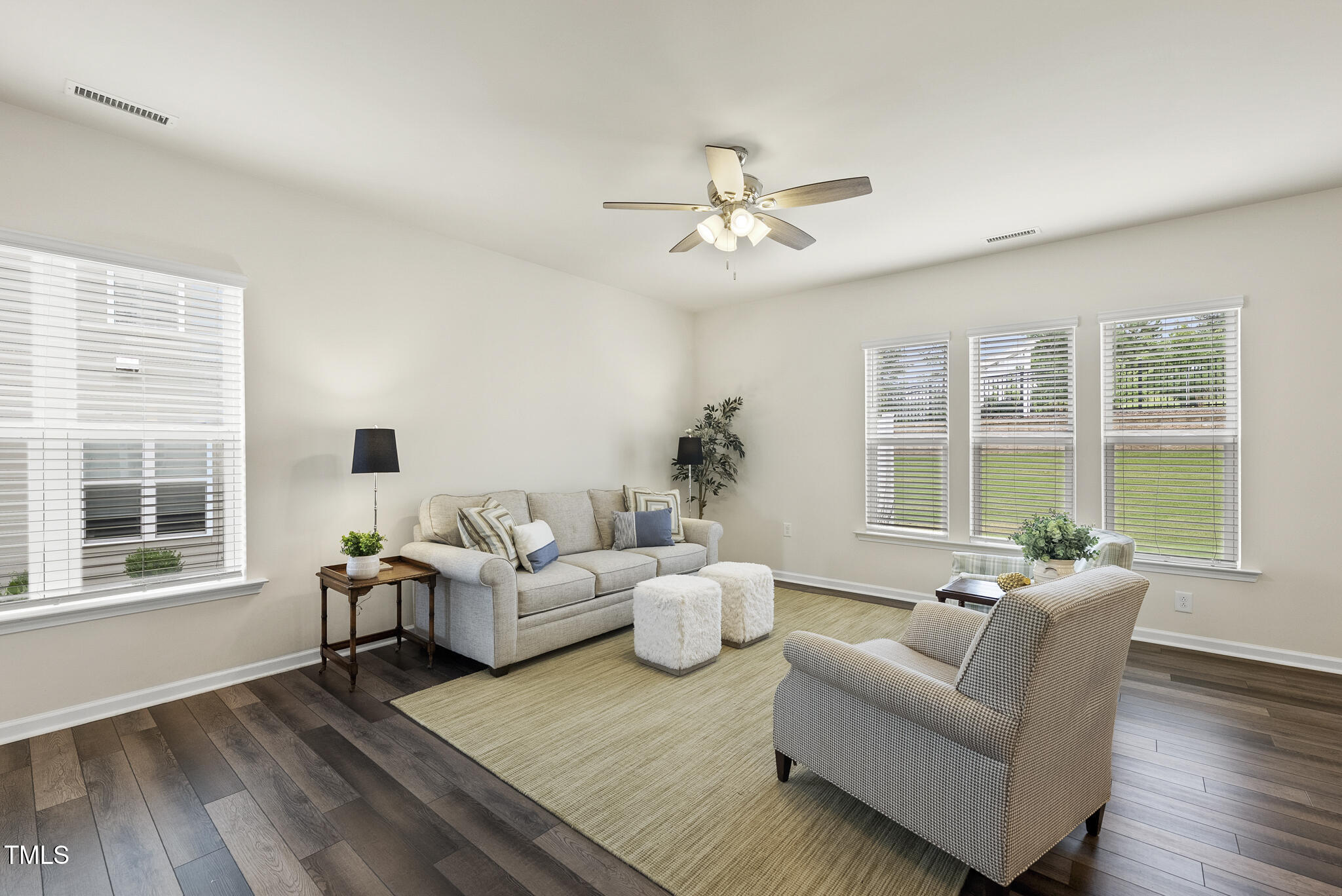 5340 Faulkner Street Durham, NC 27560 - Photo 7 of 31 a living room with furniture and a large window