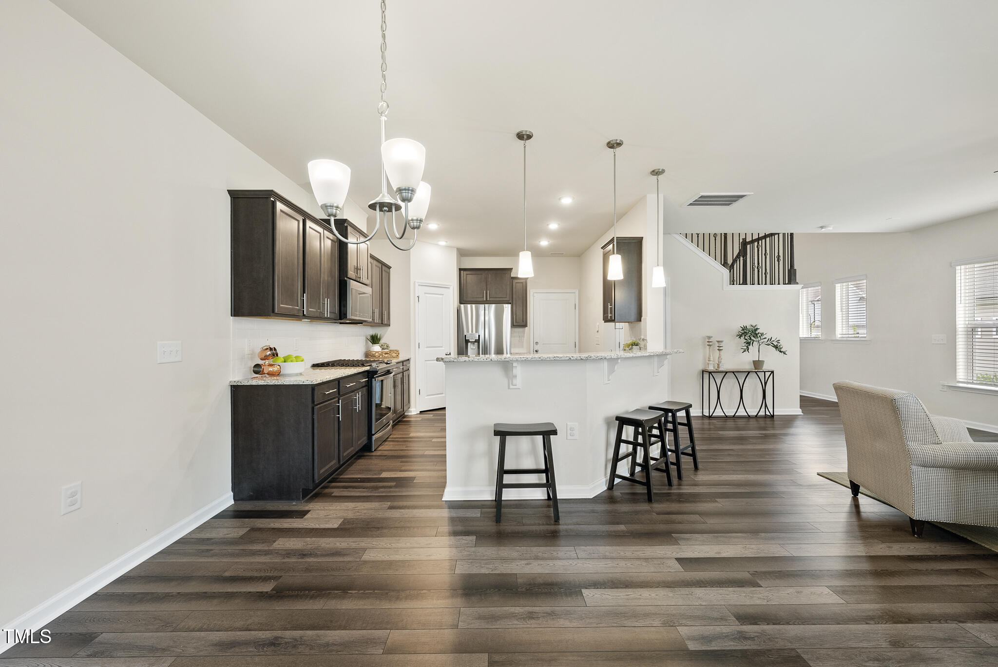 5340 Faulkner Street Durham, NC 27560 - Photo 9 of 31 a large kitchen with lots of counter space and stainless steel appliances
