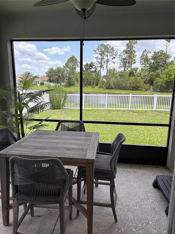 10915 79th Street East Parrish, FL 34219 - Photo 11 of 27 a view of a deck with a table chairs and a yard