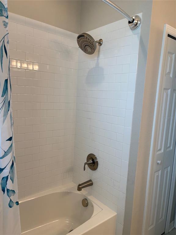 10915 79th Street East Parrish, FL 34219 - Photo 13 of 27 a bathroom with a bathtub