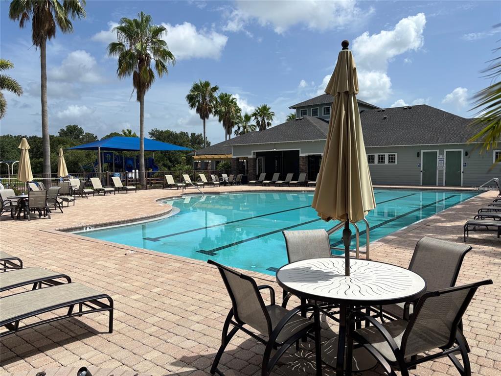 10915 79th Street East Parrish, FL 34219 - Photo 16 of 27 a swimming pool with a table and chairs