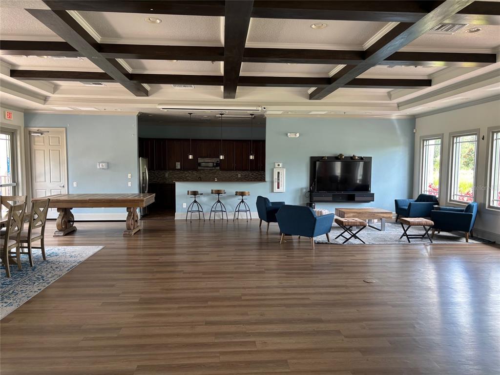 10915 79th Street East Parrish, FL 34219 - Photo 21 of 27 a living room with furniture and a flat screen tv