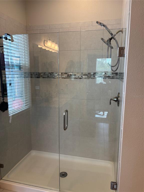 10915 79th Street East Parrish, FL 34219 - Photo 9 of 27 a bathroom with a shower